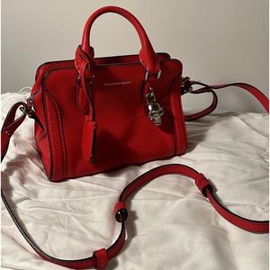 Alexander Mcqueen 
Pebbled Calfskin Mini Skull Padlock Zip Around Tote Petal